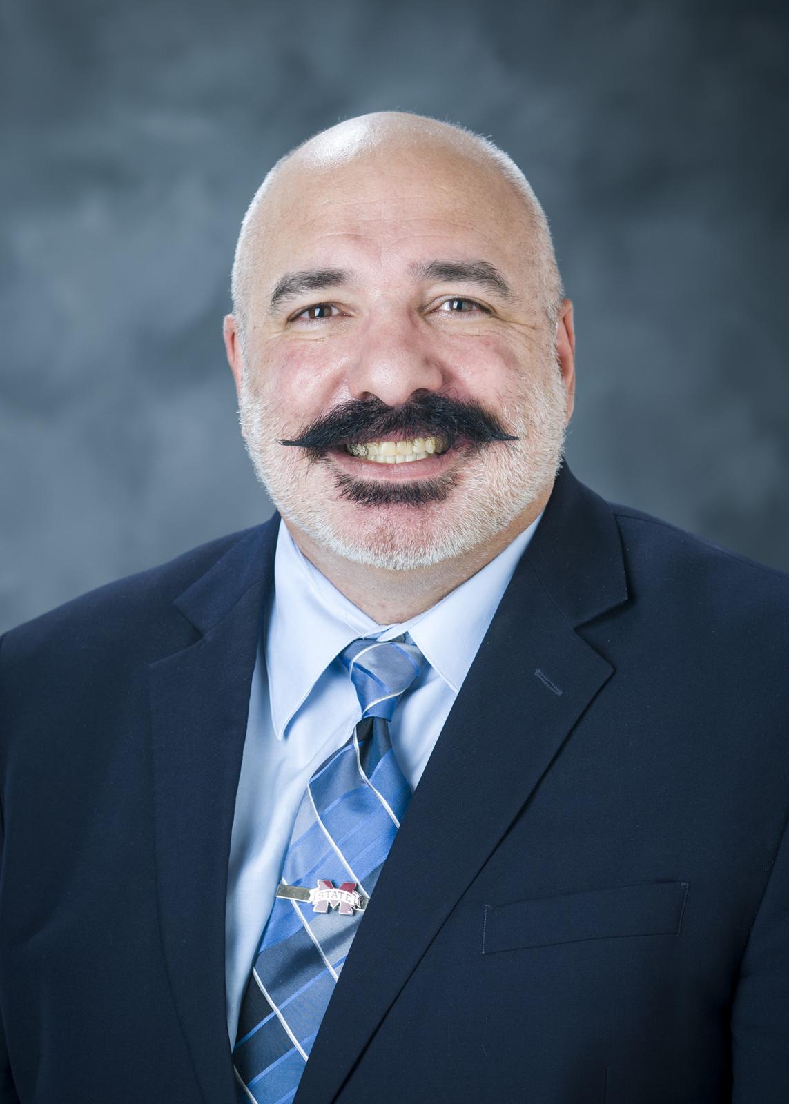 man in blue blazer