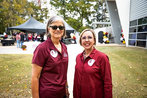 Julie Jordan, Mississippi State’s senior advisor for artificial intelligence and data governance, and Research and Curriculum Unit Director Betsey Smith, right, pose at the RCU’s 60th anniversary celebration Friday [Nov. 7].