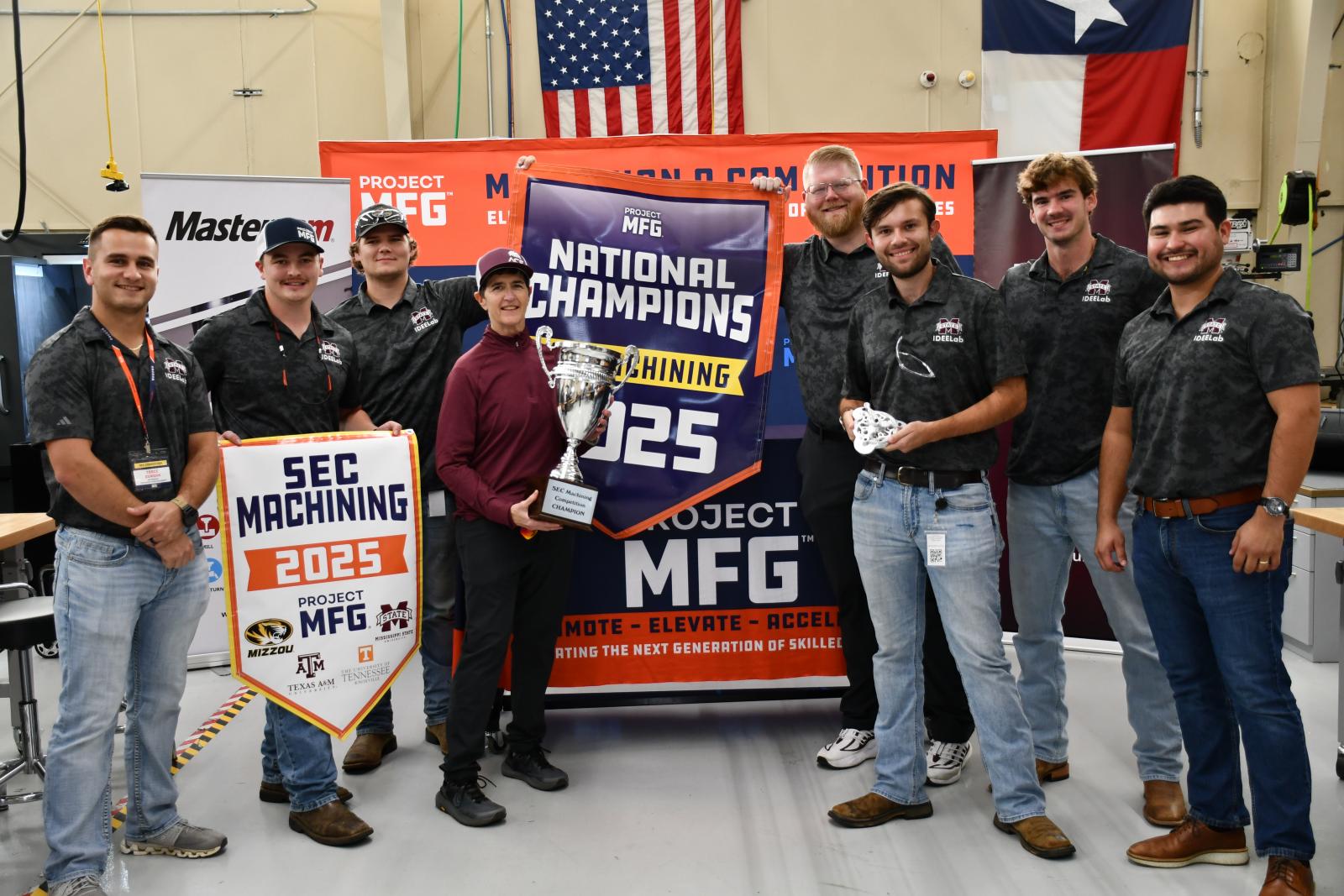 group of young men in front of banner