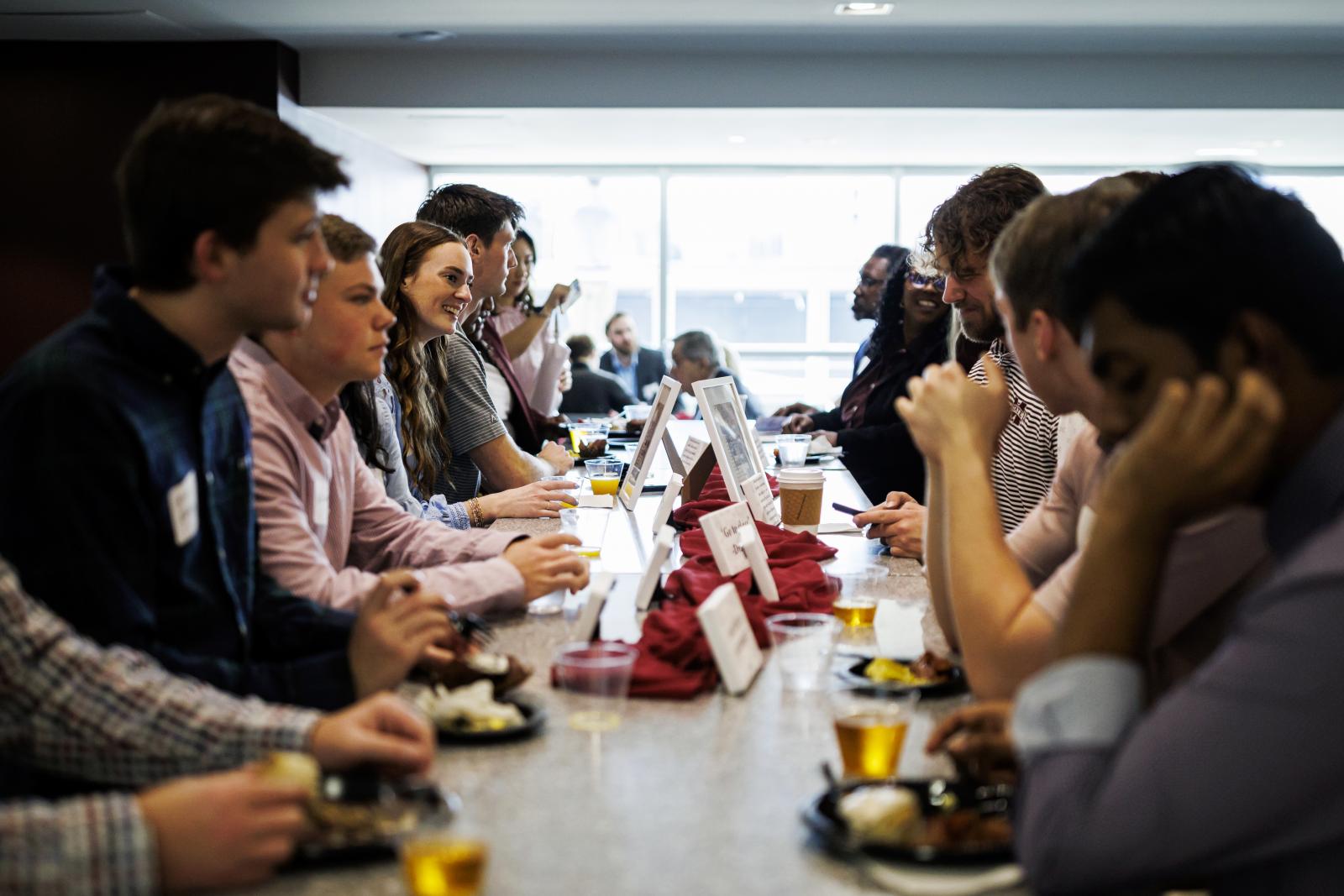 a table of men and women celebrating and networking