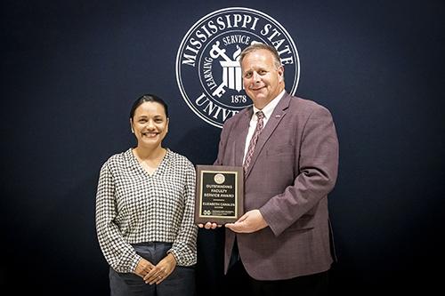 From left, Associate Professor Elizabeth Canales, agricultural economics, winner of the CALS/MAFES Outstanding Faculty Service Award with Scott Willard, CALS dean, MAFES director and interim vice president for research and economic development. (Photo by David Ammon)