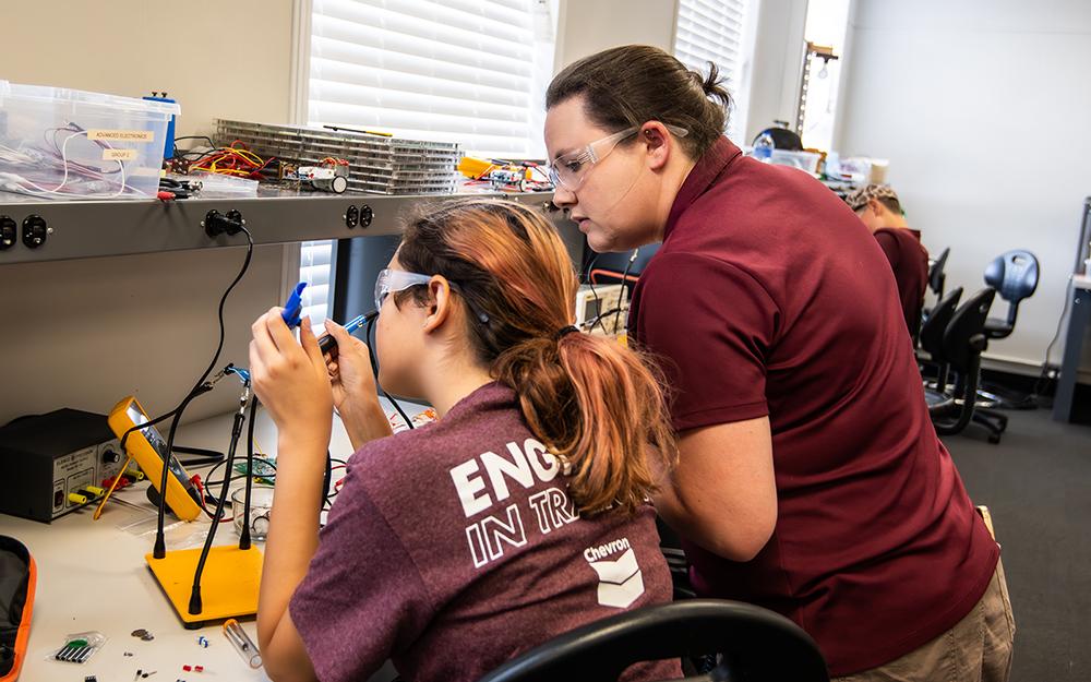 Mississippi State Instructor Lara Threet leads students in hands-on activities during last summer’s Girls Learning Industrial Technology, Teamwork, Entrepreneurship and Robotics and Bulldogs in Industrial Technology and Entrepreneurship camps.