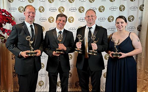 From left, Mississippi State Office of Public Affairs Associate Director David Garraway, Senior Documentary and Special Projects Producer James Parker, Creative Manager Hal Teasler and Video Producer Olivia Aylsworth hold five of the seven Southeast Emmy awards the university received in 2024.