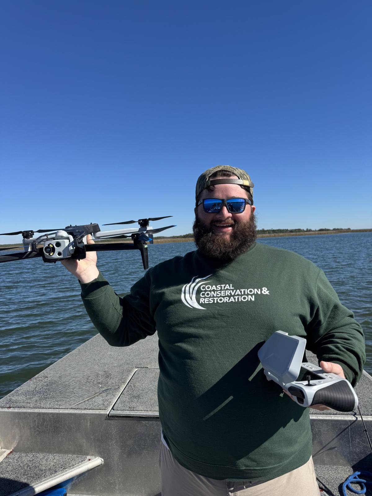 Photo of Nathan McGregor with a drone