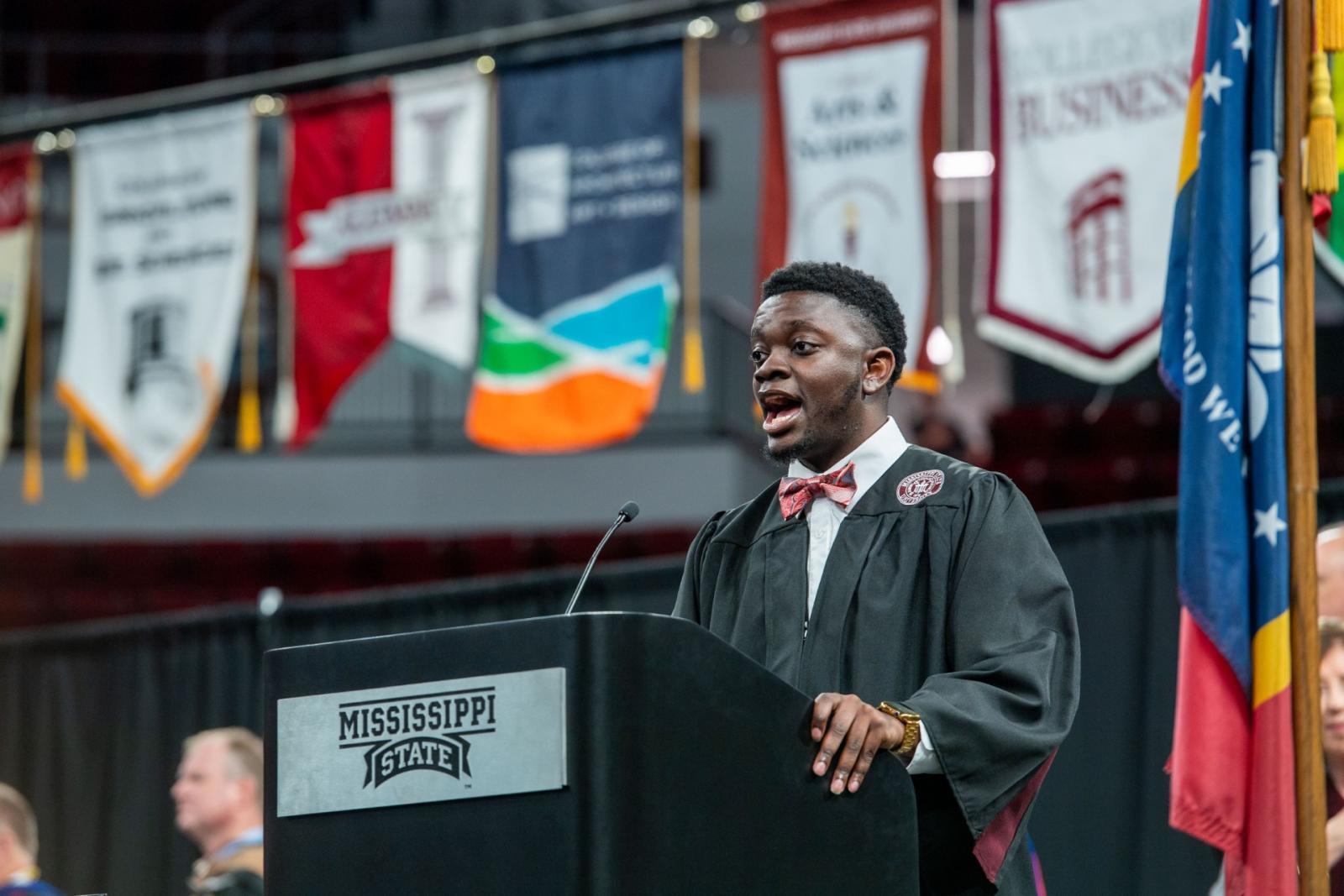 photo of Kirklyn Johnson singing at commencement