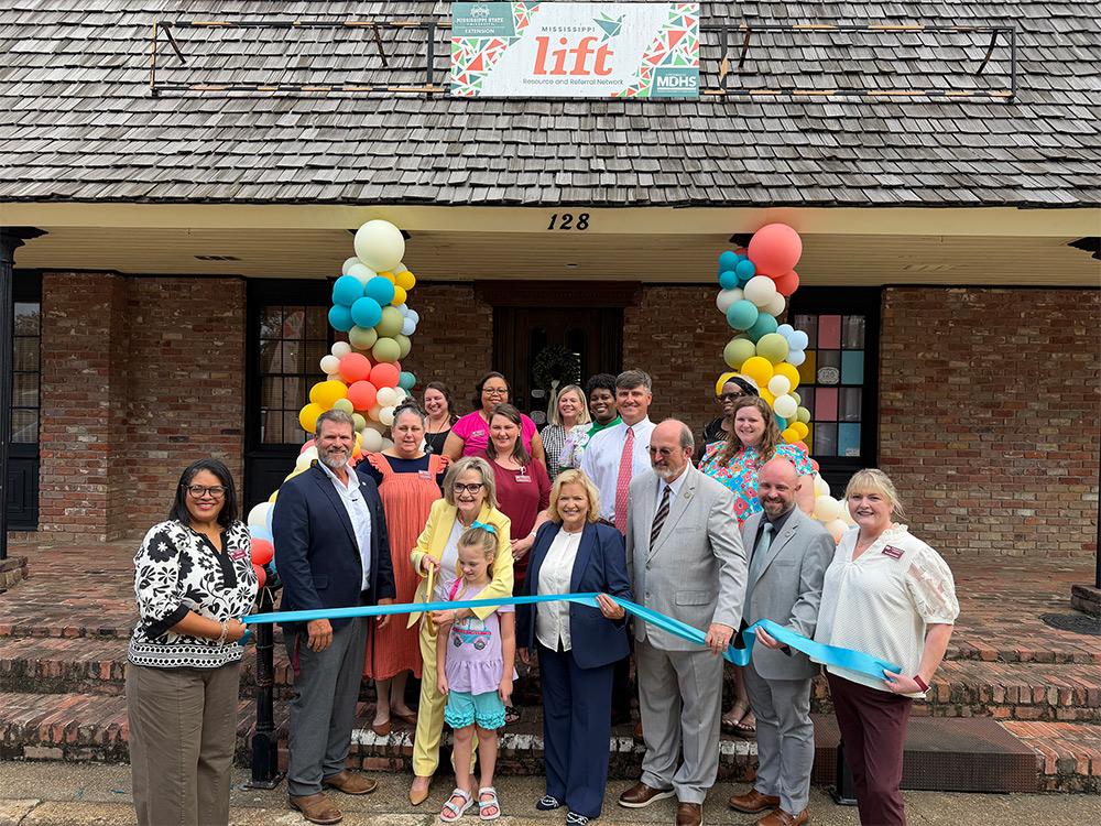 A group of university and state leaders gathered for a ribbon cutting in front of the Mississippi LIFT Resource and Referral Network Center in Brookhaven