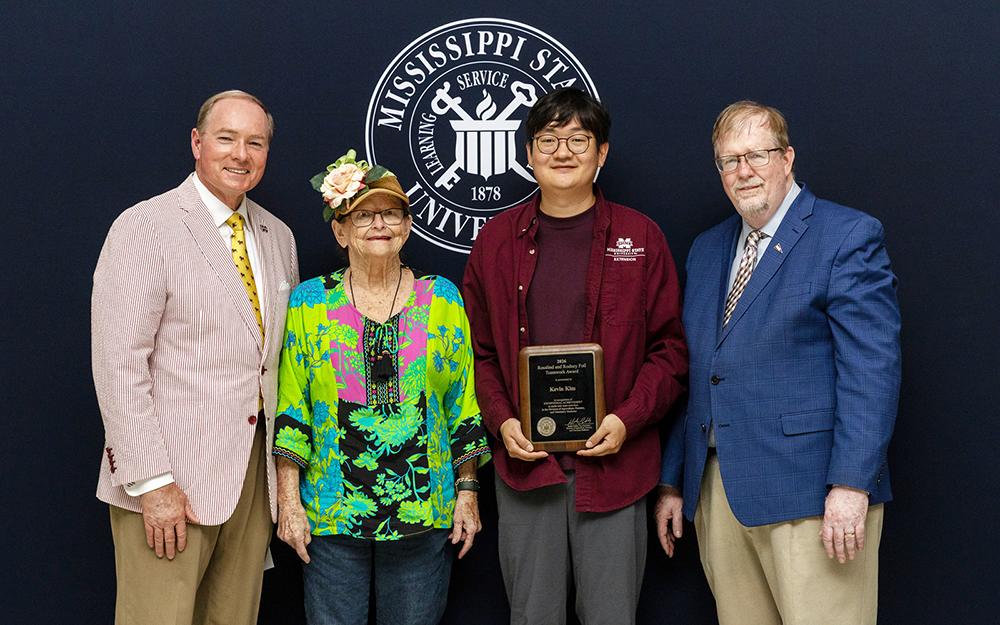 Pictured from left are MSU President Mark E. Keenum, Rosalind Foil, Kevin Kim and Keith Coble.