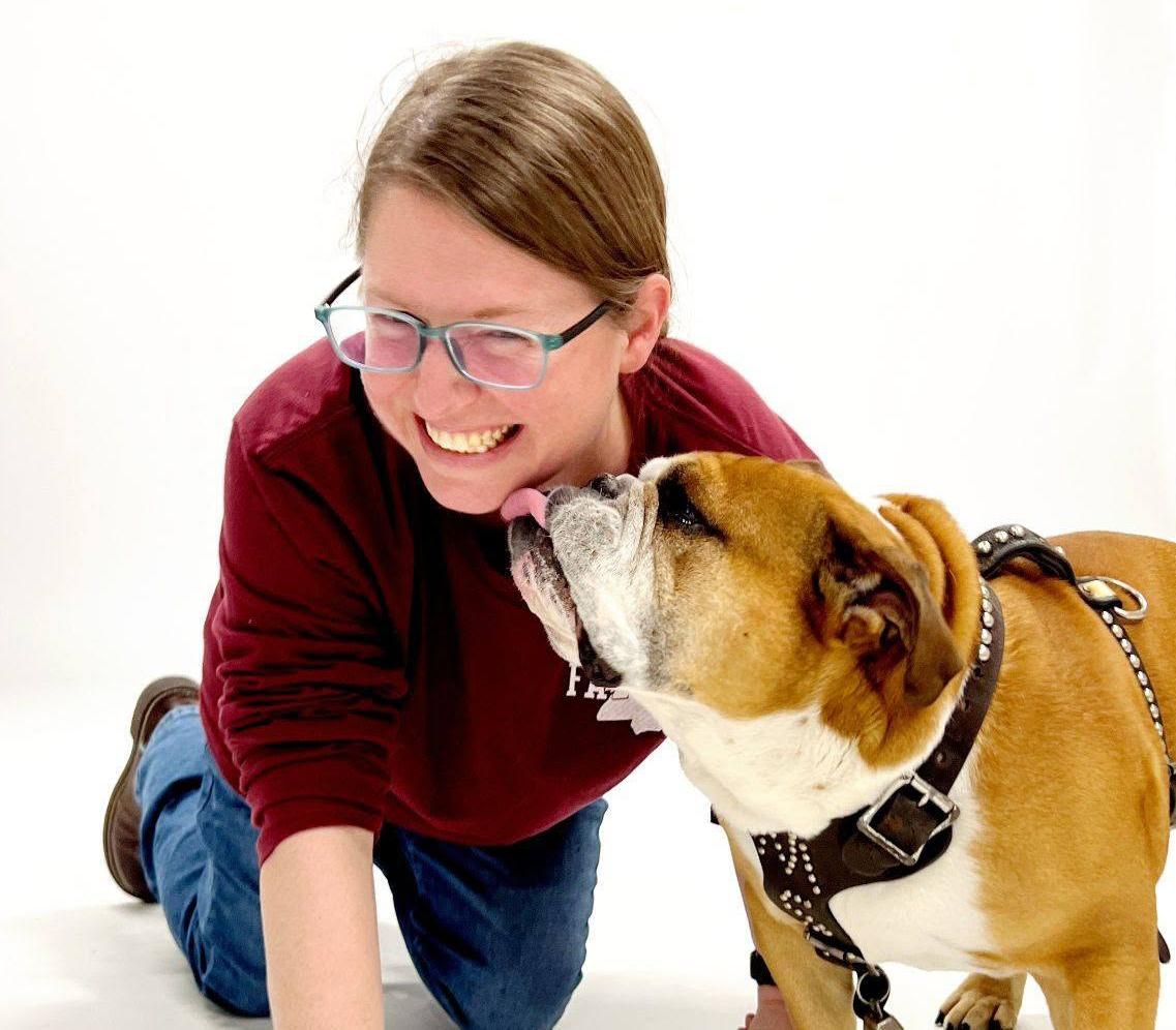 Beth Wynn in the studio with university mascot during photoshoot.
