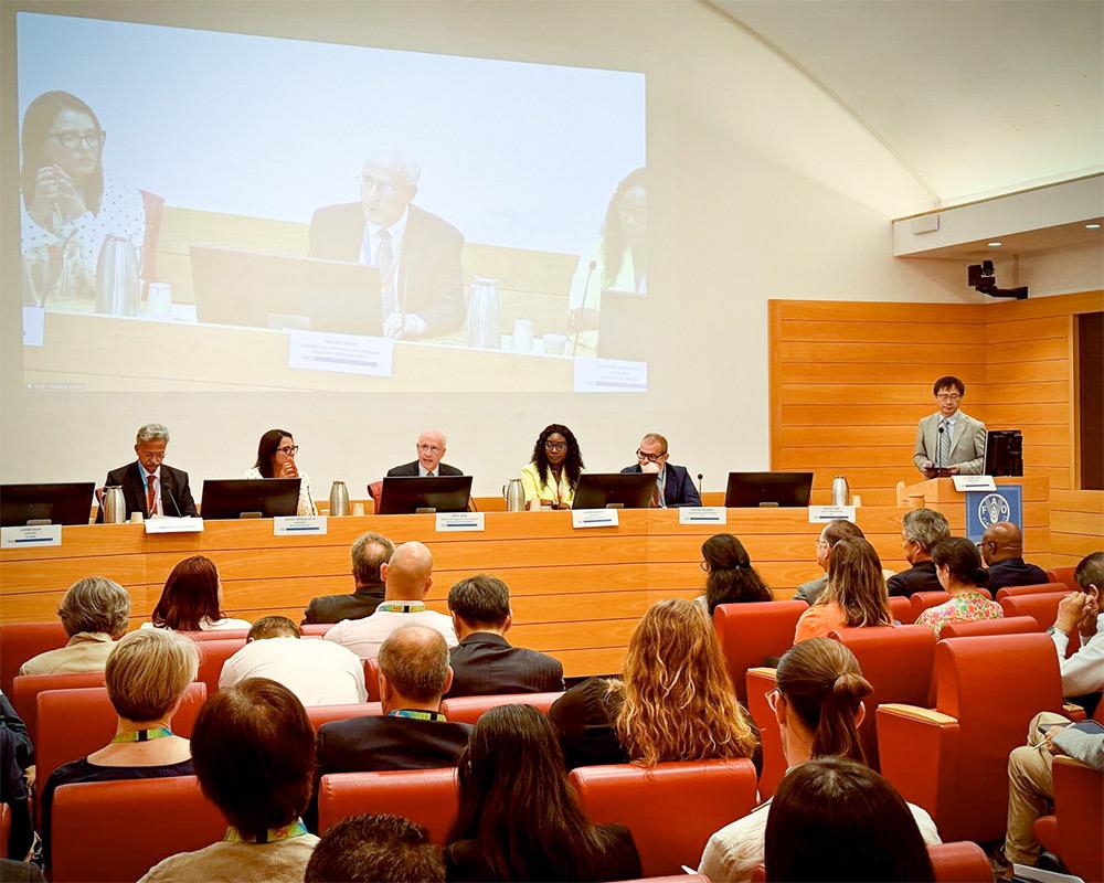 Mississippi State University Provost and Executive Vice President David Shaw, center of panel and screen, gives remarks at FAO headquarters in Rome, Italy, today [Sept. 22] as part of an agri-food systems conference.