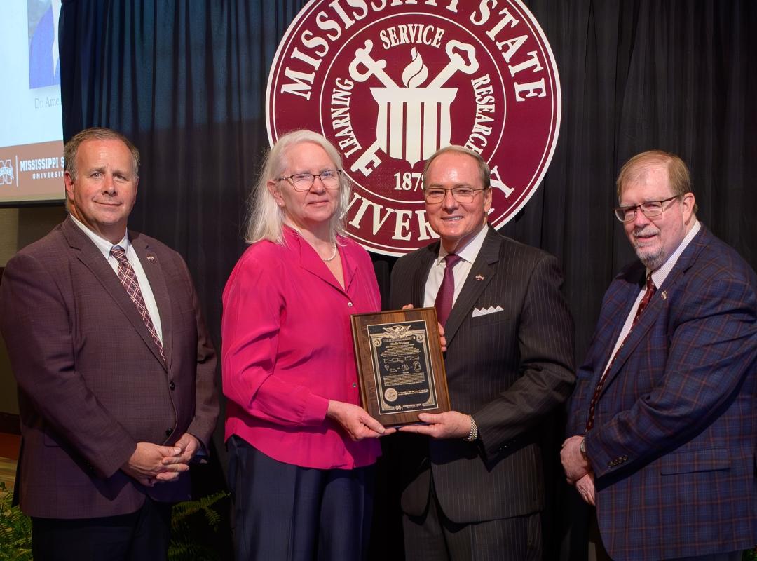 MSU VPs and Presidnet with award winner Amelia Woolums