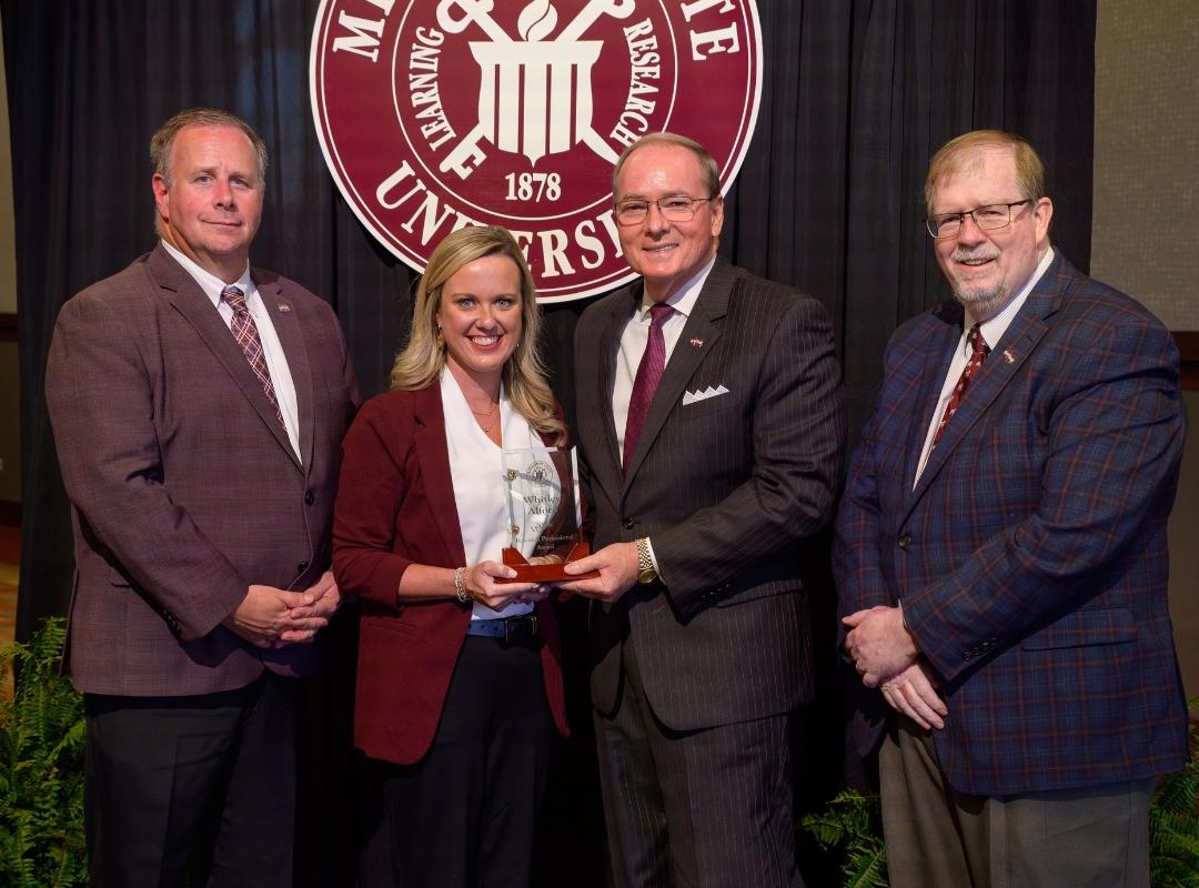 photo of MSU VPs and president with award winner Whitley Alford